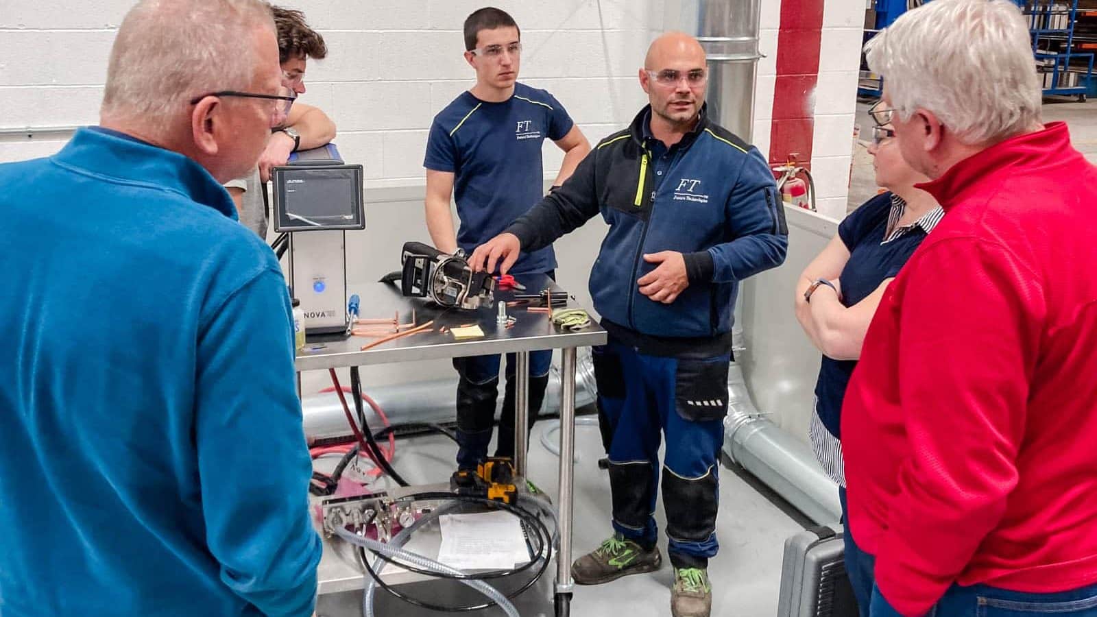 Airserco team members demonstrating A2L charging installation at OEM Manufacturing PLant