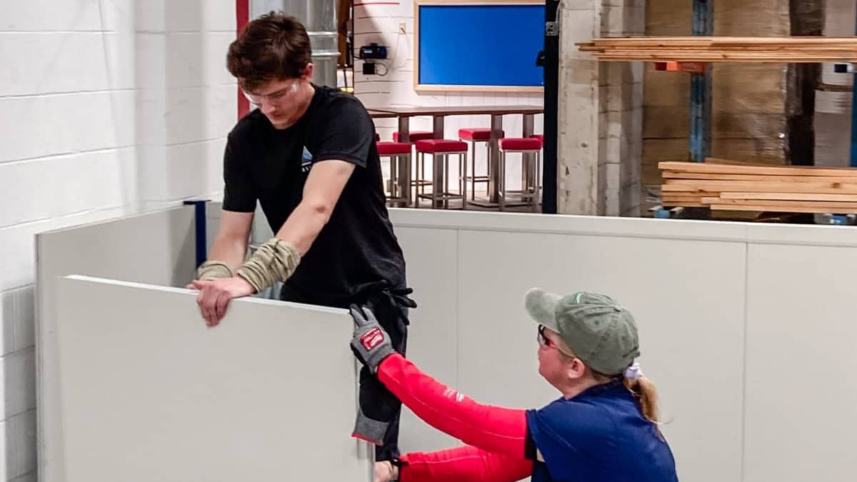 Airserco team members installing a2l enclosure OEM Manufacturing Plant