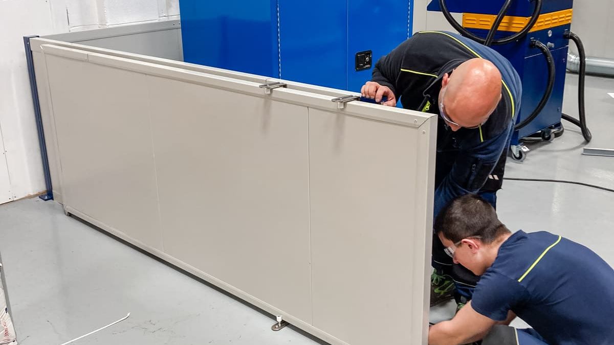 Airserco team members installing A2L refrigerant charging system enclosure OEM Manufacturing Plant